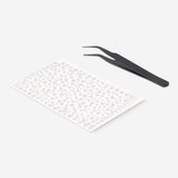 Flying Tiger Copenhagen nail decorating kit with colorful rhinestones for personal care and creative nail art.