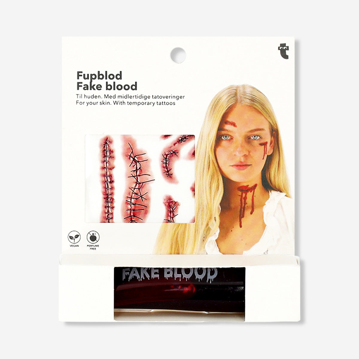 Fake blood for skin and temporary tattoos from Flying Tiger Copenhagen, shown spread on a flat surface with tattoo designs nearby.