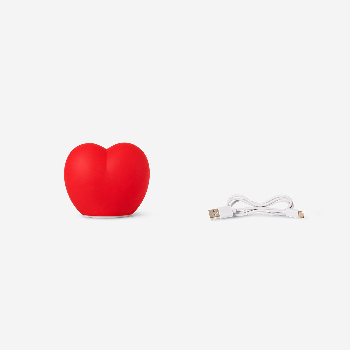 Red heart-shaped cosy lamp from Flying Tiger Copenhagen, designed for home decor and ambient lighting.