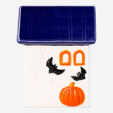 Decorative ceramic Halloween house by Flying Tiger Copenhagen, 13 cm tall, with spooky design and detailed windows.