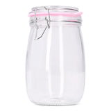 Glass jar with pink rim, 17 cm tall, used for kitchen storage, by Flying Tiger Copenhagen. Transparent with a colorful pink accent.