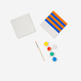 Three DIY ceramic tiles from Flying Tiger Copenhagen hobby collection, showcasing colorful patterns and textured surfaces.