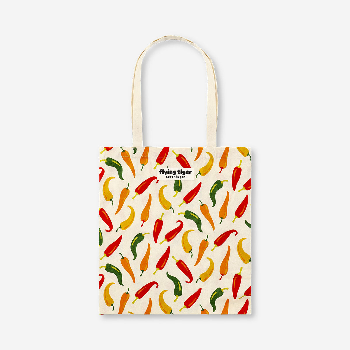 Colorful textile tote bag with chili pepper print from Flying Tiger Copenhagen, featuring sturdy handles and spacious interior.