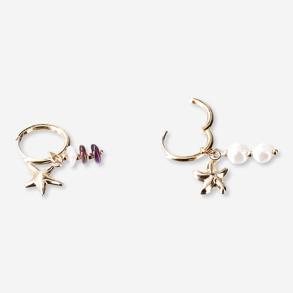 Textile hanging earrings featuring seastar charms and decorative details, designed by Flying Tiger Copenhagen.
