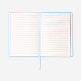 A6 office notebook with colorful rainbow-edged pages by Flying Tiger Copenhagen, open to show lined pages inside.