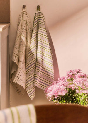 Set of two Flying Tiger Copenhagen check and stripe kitchen tea towels, soft cotton fabric with colorful patterns.