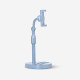 Blue adjustable media stand for smartphones and tablets by Flying Tiger Copenhagen, showing the flexible stand with devices attached.