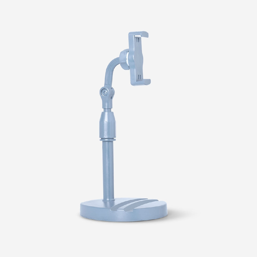 Blue adjustable media stand for smartphones and tablets by Flying Tiger Copenhagen, showing the flexible stand with devices attached.