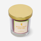 Flying Tiger Copenhagen scented candle with bergamot and fig fragrance, showcasing a decorative candle in a glass holder.