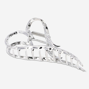 Silver heart textile hair clip by Flying Tiger Copenhagen, featuring a shiny heart-shaped design for stylish hair accessories.