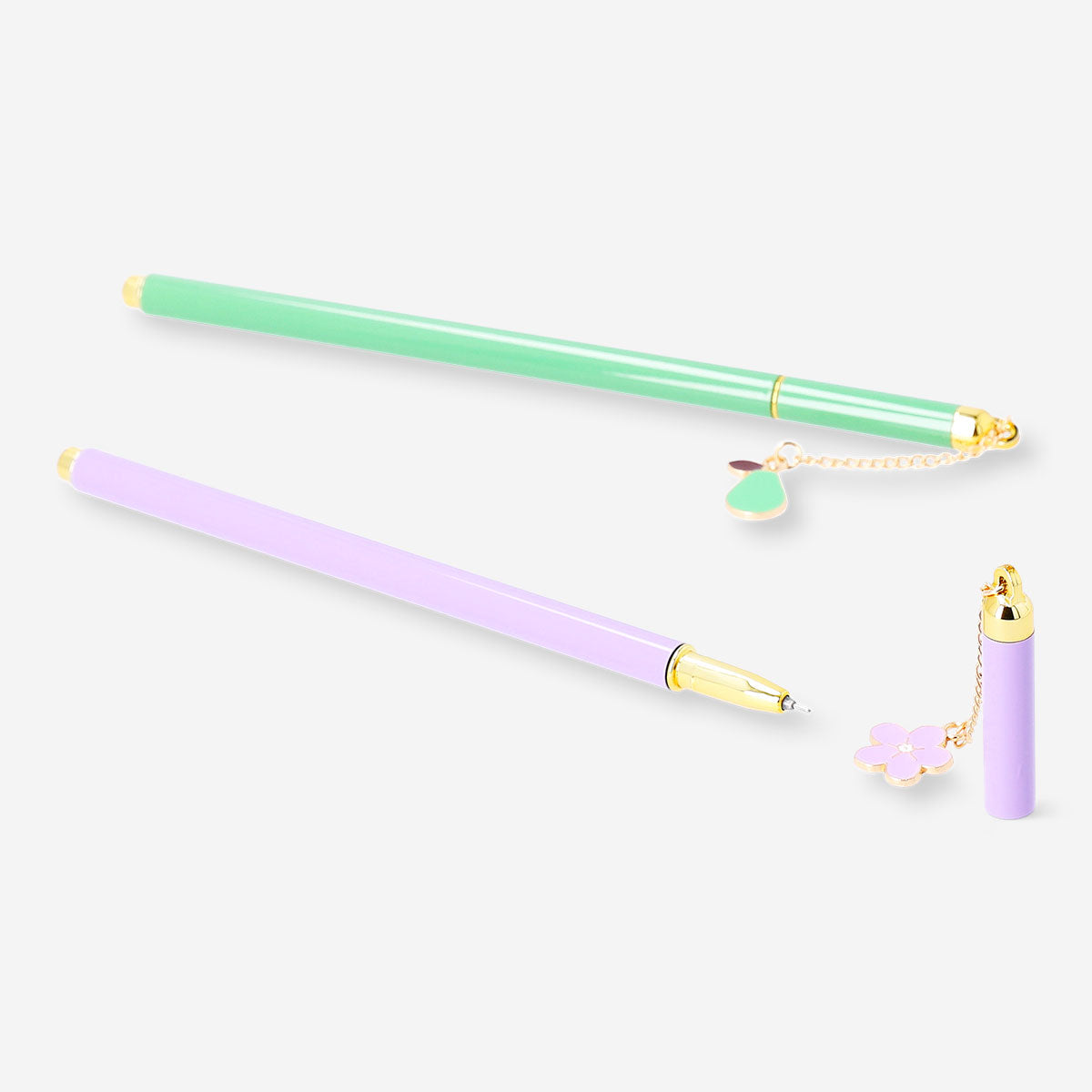 Two Flying Tiger Copenhagen ballpoint pens with decorative charms, ideal for office use, featuring colorful designs and smooth ink flow.
