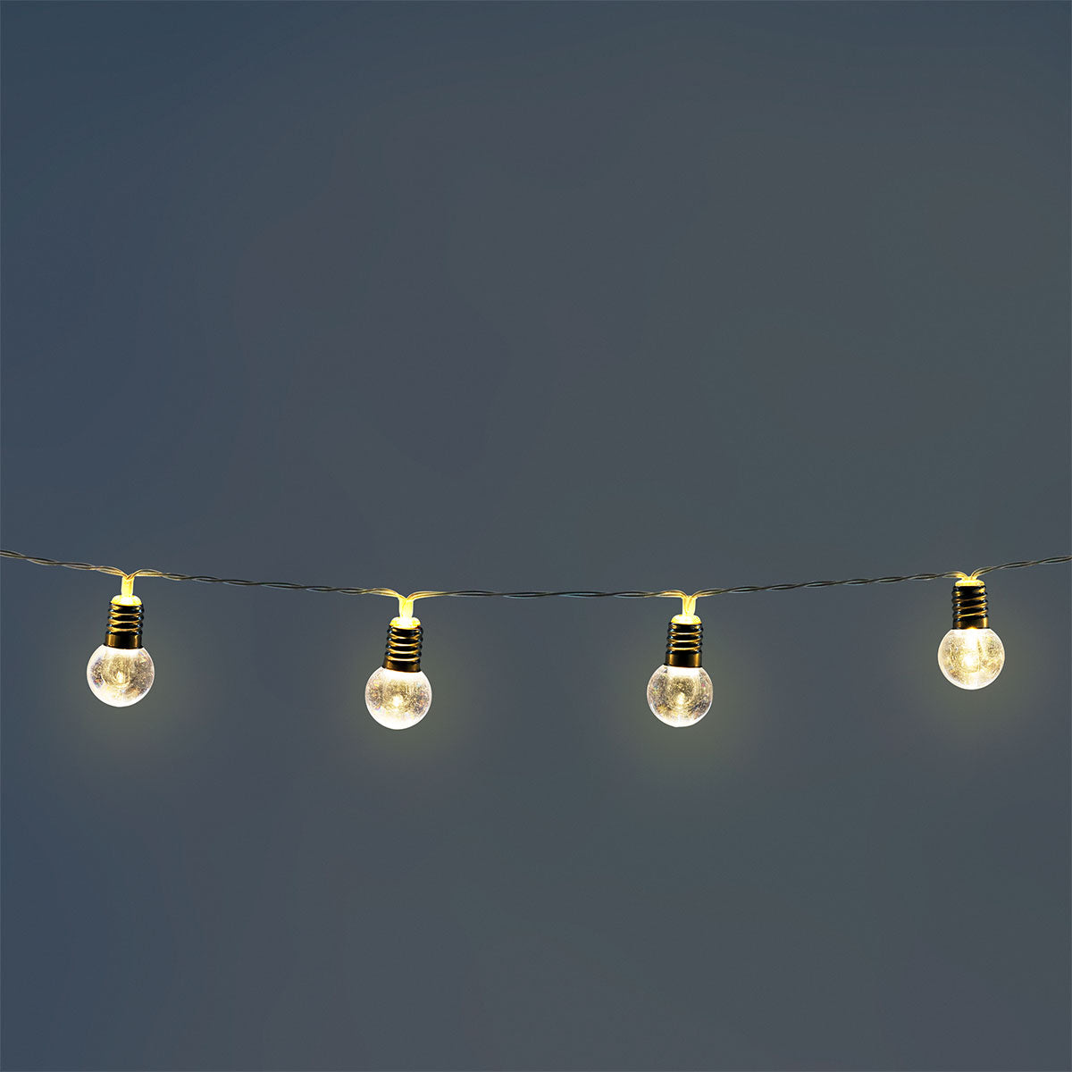 Clear bulb string lights for home, featuring multiple glowing bulbs on a flexible cord from Flying Tiger Copenhagen.