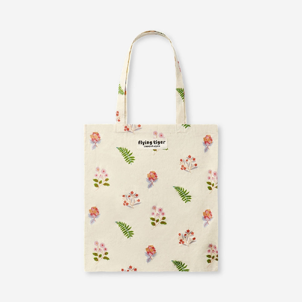 Flying Tiger Copenhagen floral print textile tote bag with colorful flower design and sturdy handles for everyday use.