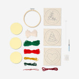 Flying Tiger Copenhagen Christmas punch needle set for hobby crafting, featuring festive designs and colorful embroidery supplies.