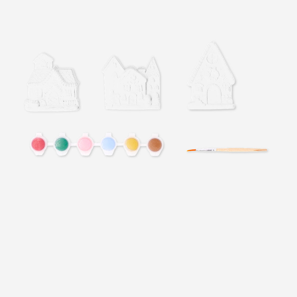 Flying Tiger Copenhagen DIY plaster Christmas houses for crafting, with detailed holiday-themed miniature house models.