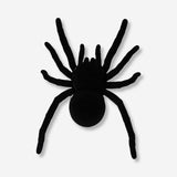 Vibrating black spider toy with multiple legs from Flying Tiger Copenhagen, shown on a plain background.