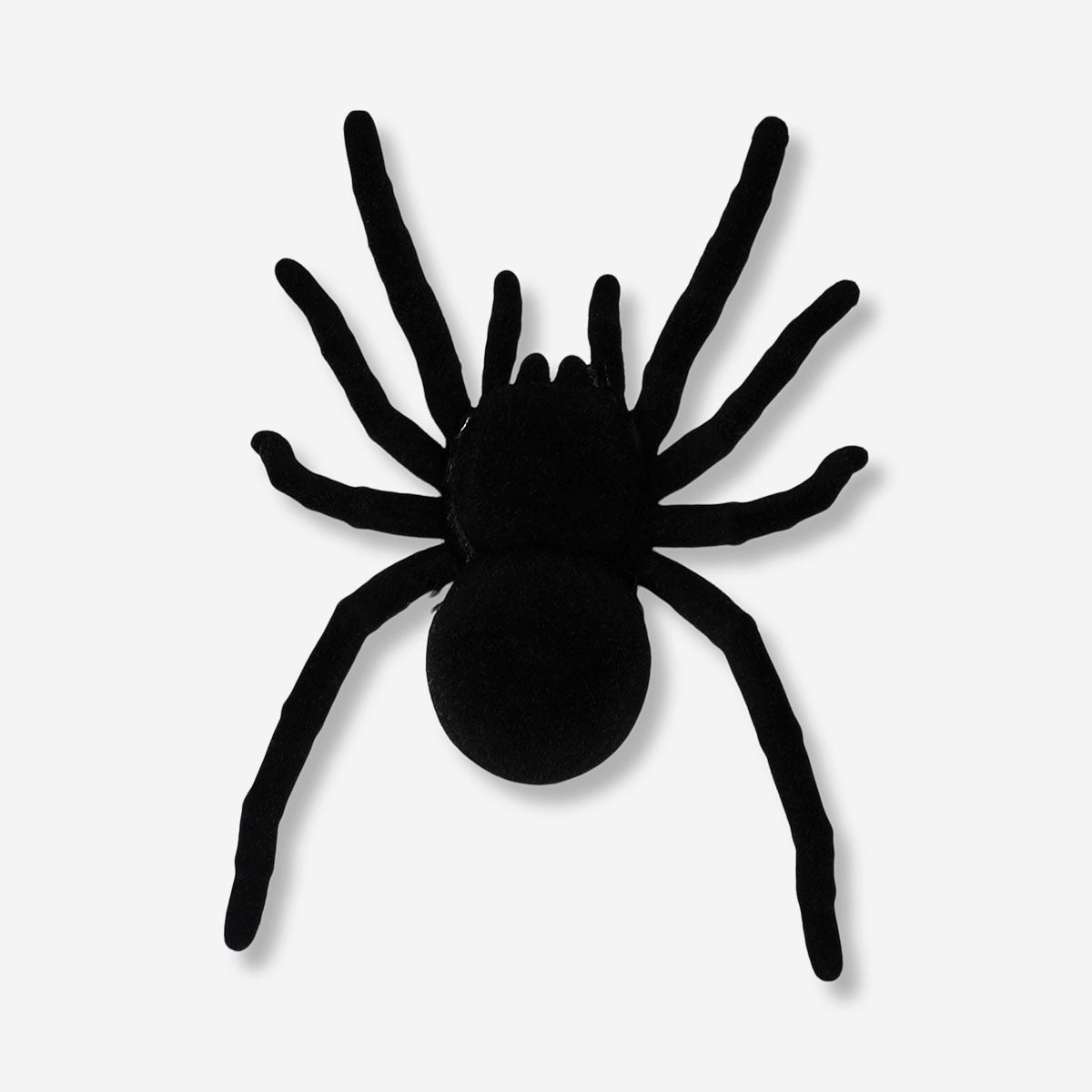Vibrating black spider toy with multiple legs from Flying Tiger Copenhagen, shown on a plain background.