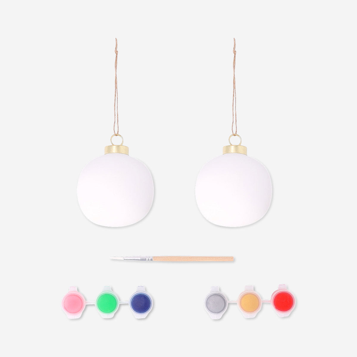 Two DIY ceramic baubles for crafting, hobby project by Flying Tiger Copenhagen, featuring smooth, rounded shapes and a glossy finish.