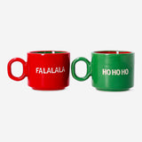 Two Flying Tiger Copenhagen cortado mugs with Christmas-themed text, featuring festive holiday designs for kitchen use.