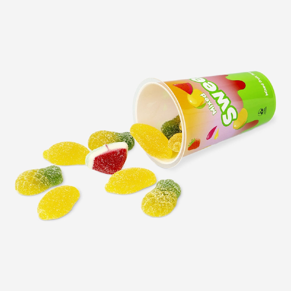 Assorted mixed candies in a cup, colorful sweets from Flying Tiger Copenhagen, displayed in a clear cup on a white background.