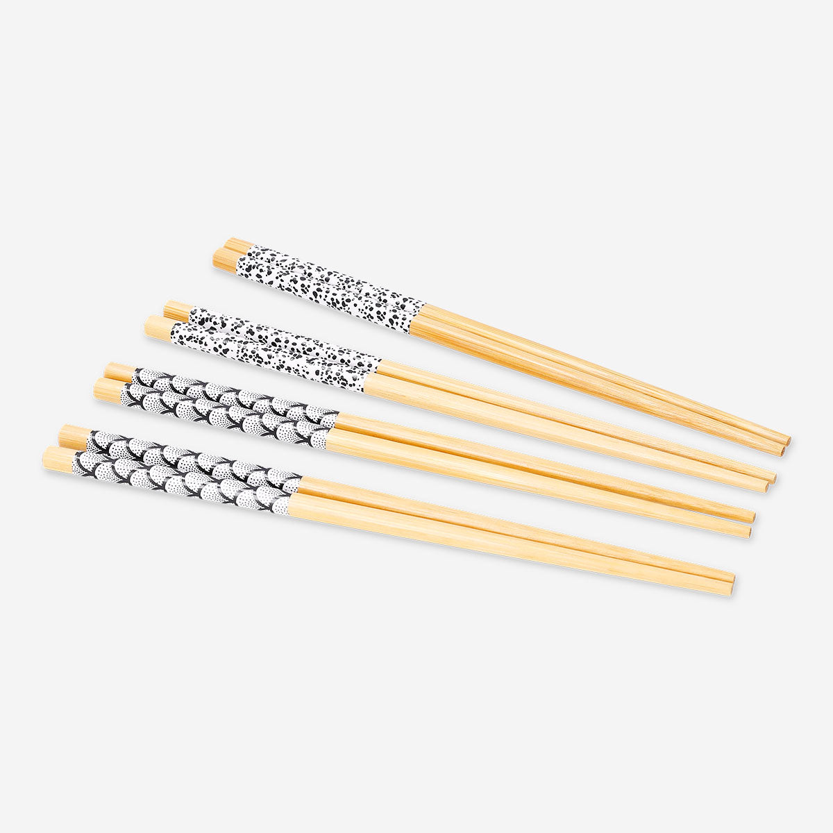Eight printed kitchen chopsticks by Flying Tiger Copenhagen, featuring colorful patterns, ideal for Asian cuisine dining.