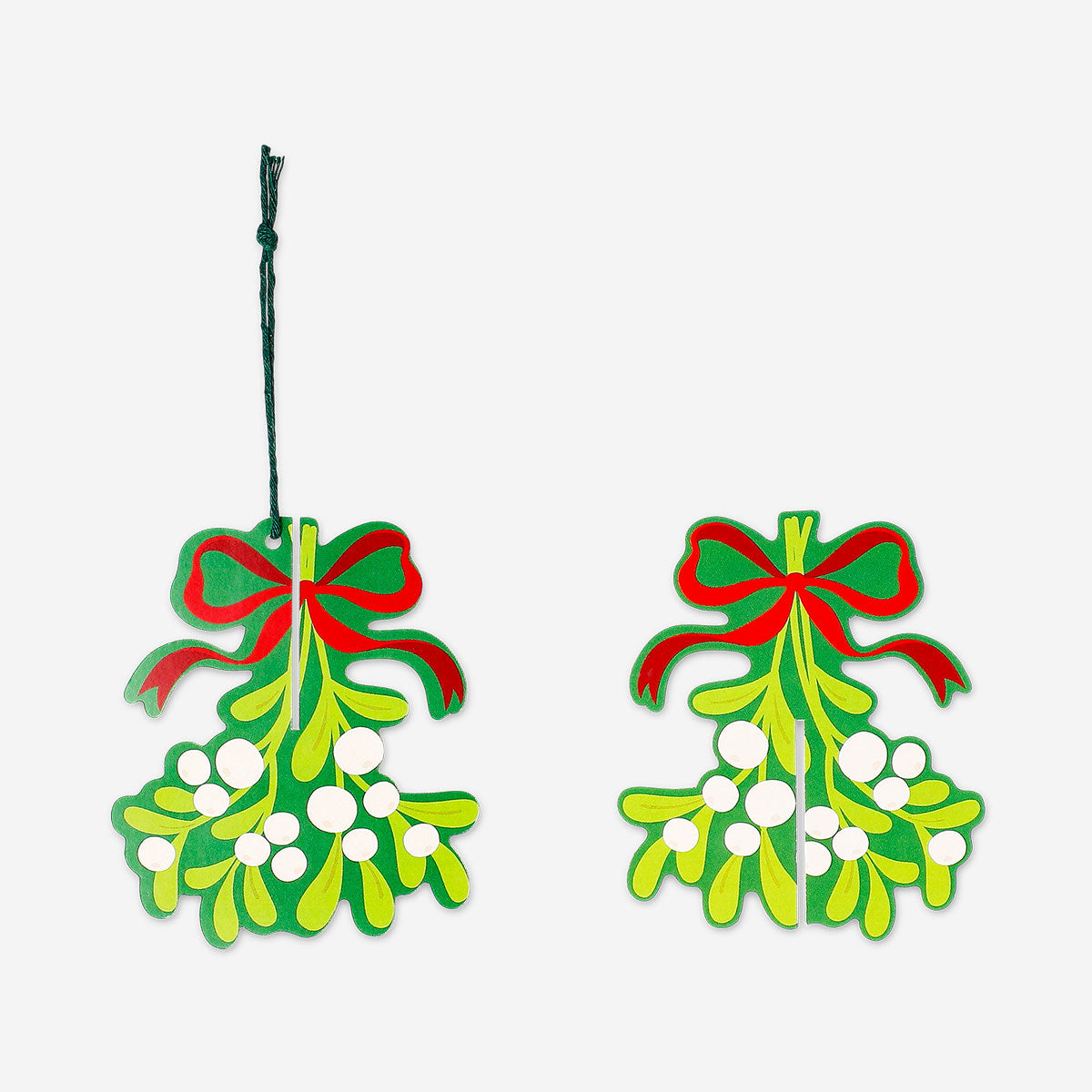 Four hanging paper mistletoes for party decorations, colorful and festive by Flying Tiger Copenhagen.