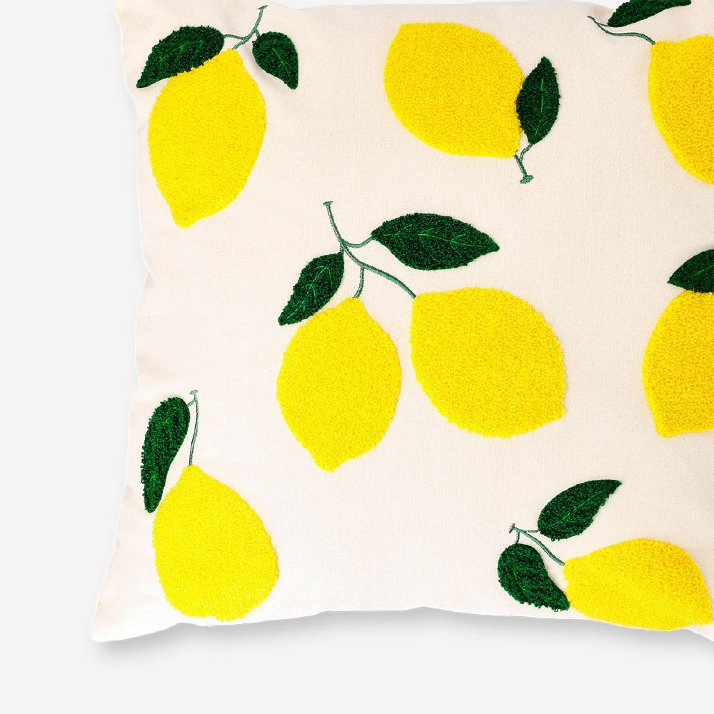 Lemon print cushion from Flying Tiger Copenhagen, 45x45 cm, featuring bright yellow lemon illustrations on soft fabric.
