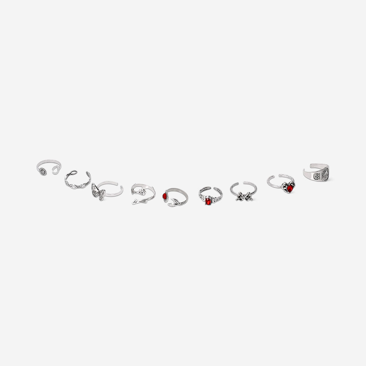 Set of 9 adjustable gothic-style textile rings with romantic design by Flying Tiger Copenhagen displayed on a surface.