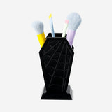 Flying Tiger Copenhagen coffin-shaped cosmetic organiser for personal care, with compartments for makeup and beauty items.