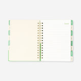 Green Flying Tiger Copenhagen study planner for 2026-2027, open to pages with calendar and note sections, designed for students.
