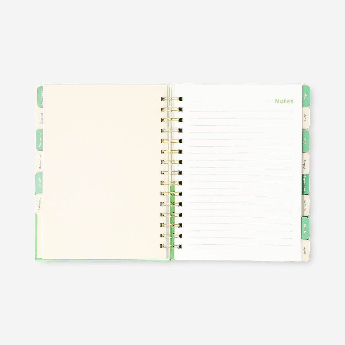 Green Flying Tiger Copenhagen study planner for 2026-2027, open to pages with calendar and note sections, designed for students.