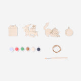 Set of four DIY wooden Christmas ornaments from Flying Tiger Copenhagen, featuring natural wood finishes for holiday crafting.