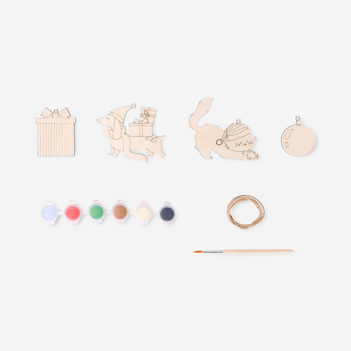 Set of four DIY wooden Christmas ornaments from Flying Tiger Copenhagen, featuring natural wood finishes for holiday crafting.