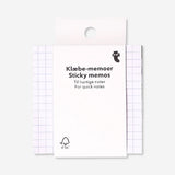 Flying Tiger Copenhagen sticky memos with grid pattern for office organization and note-taking.
