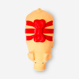 Flying Tiger Copenhagen pet chew toy pig wrapped with red ribbon, made of durable material for pets' leisure play.