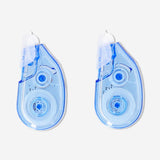 Two Flying Tiger Copenhagen correction tape dispensers for office use, compact and easy to apply for quick mistake correction.