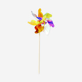 Colorful rainbow pinwheel toy from Flying Tiger Copenhagen, 57x24 cm, featuring vibrant blades spinning in the wind.