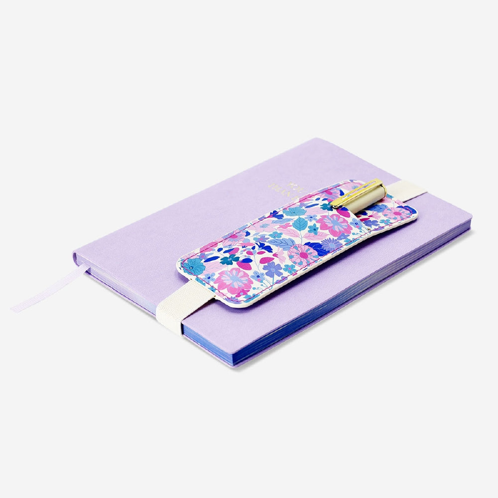 Floral office pen holder with strap for books by Flying Tiger Copenhagen, featuring colorful flower patterns and a practical strap.