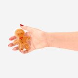Flying Tiger Copenhagen gingerbread man pocket heat pad gadget, portable warming accessory with festive gingerbread design.