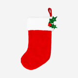 Red bouclé Christmas stocking with textured fabric and hanging loop, perfect for festive holiday home decor.