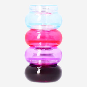 Flying Tiger Copenhagen travel set with four stackable jars for leisure and storage, shown in the image.