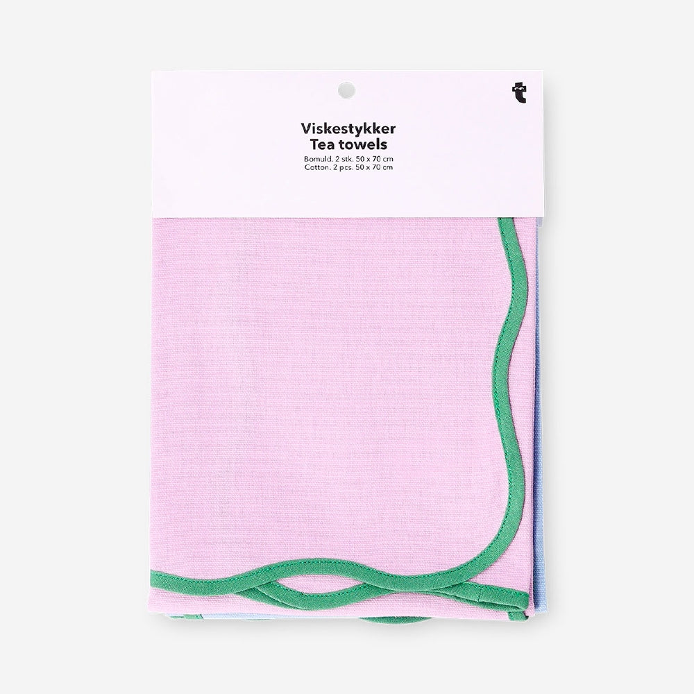 Two kitchen tea towels with scalloped edges from Flying Tiger Copenhagen, shown laid flat for drying and decorative use.