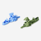Two colorful flying dragon toy figures from Flying Tiger Copenhagen, featuring detailed scales and wings.