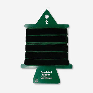 Green velvet ribbon from Flying Tiger Copenhagen, 5 meters long, shown rolled out on a flat surface with a soft texture.
