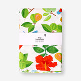 Tropical print tablecloth from Flying Tiger Copenhagen, 140x220 cm, featuring vibrant leaf and floral designs for home table decor.