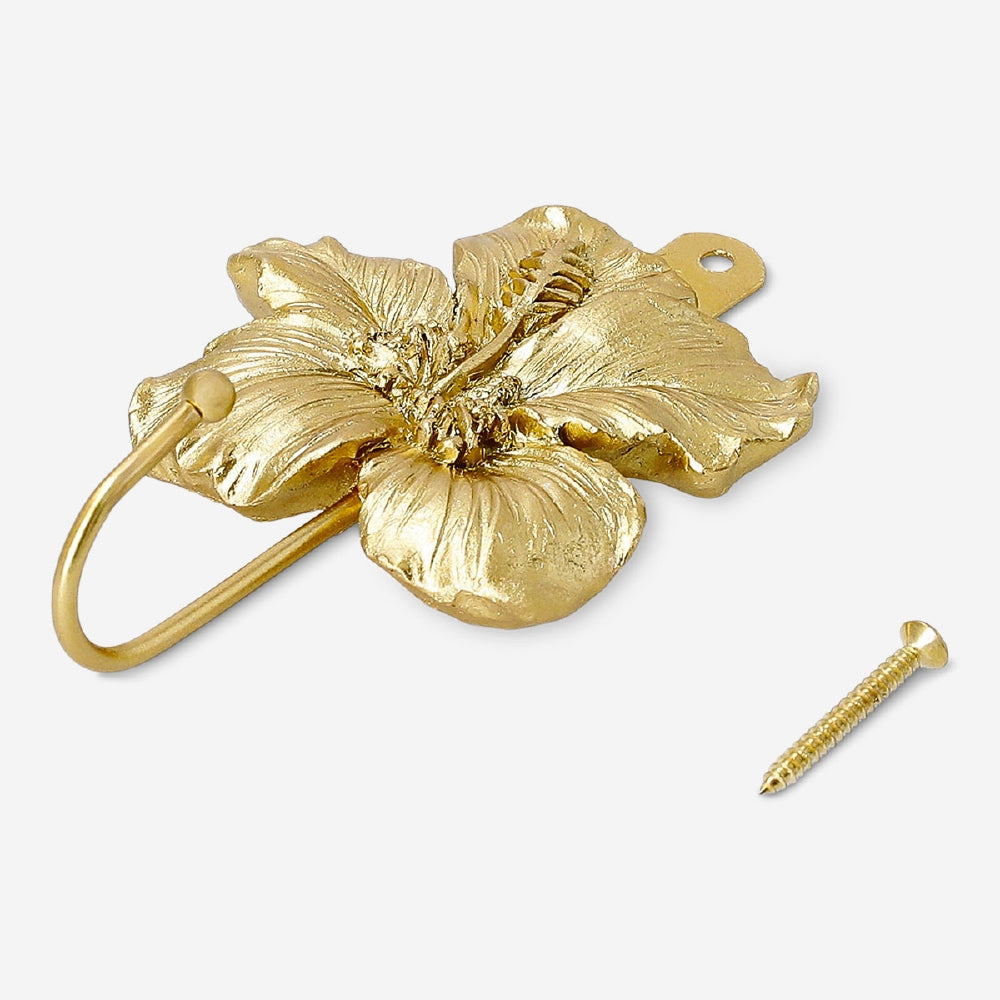 Gold flower hook for home, Flying Tiger Copenhagen, decorative metal wall hook with floral design for hanging items.