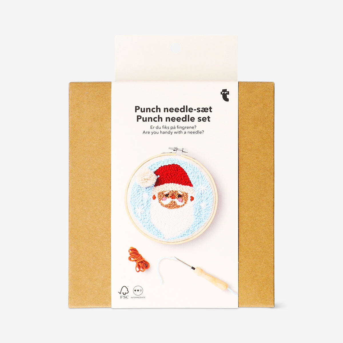 Flying Tiger Copenhagen punch needle Santa craft set with colorful threads and tools for holiday embroidery projects.