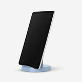 Blue adjustable media stand for smartphones and tablets by Flying Tiger Copenhagen, holding devices in a stable position.