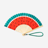 Foldable bamboo fan with watermelon print and strap, textile material, by Flying Tiger Copenhagen, shown open with vibrant design.