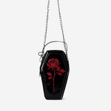 Black coffin-shaped handbag made of textile by Flying Tiger Copenhagen, featuring a spooky coffin design and zipper closure.